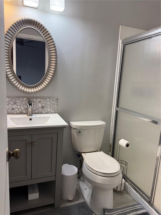 2912 NW 80th Ave, Sunrise, FL 33322 - full bath featuring decorative backsplash, vanity, a shower with door, and toilet