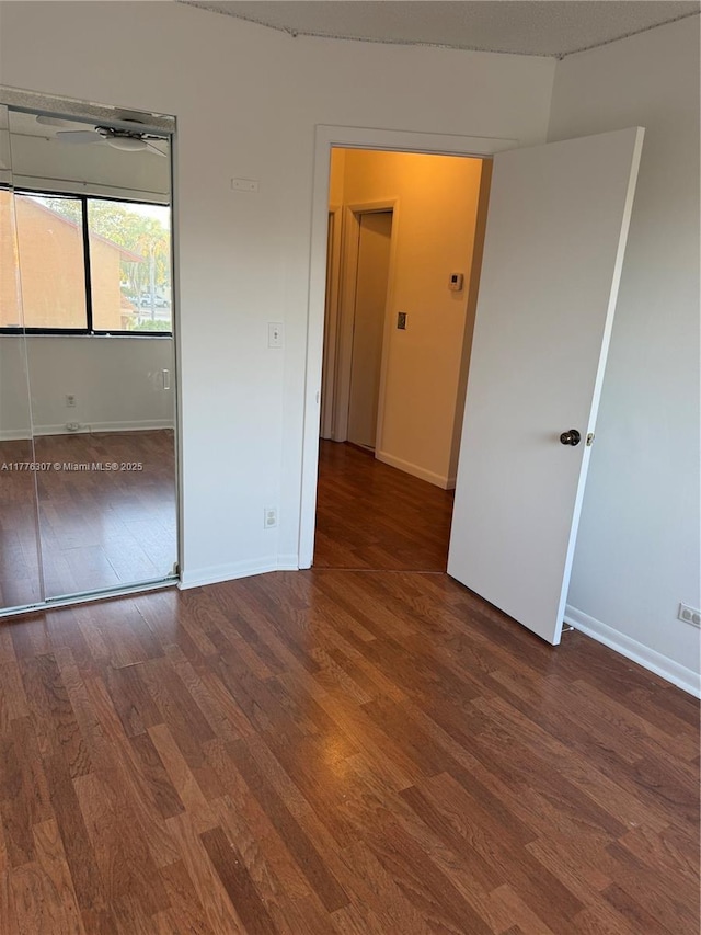 2912 NW 80th Ave, Sunrise, FL 33322 - unfurnished bedroom with baseboards and wood finished floors