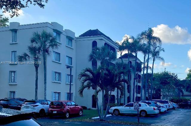 6342 W Longboat Ln W Unit C201, Boca Raton, FL 33433 - view of property featuring uncovered parking