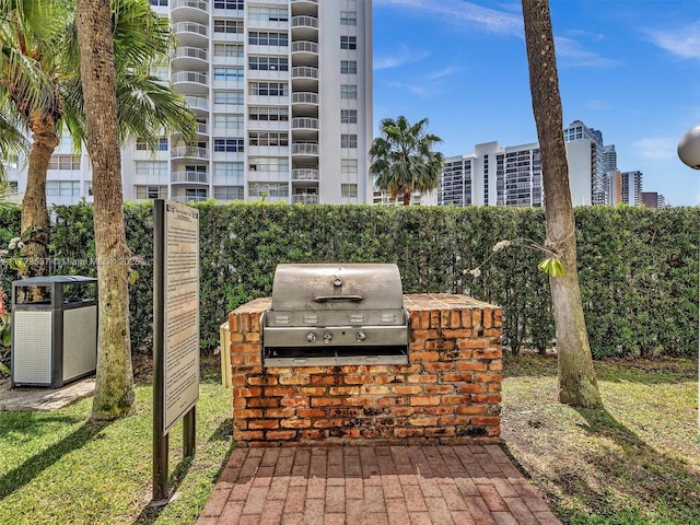 1408 Brickell Bay Dr Unit 816, Miami, FL 33131 - view of patio featuring central AC unit, grilling area, and area for grilling