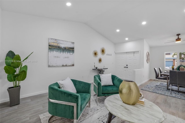 living room with lofted ceiling, wood finished floors, recessed lighting, and a ceiling fan