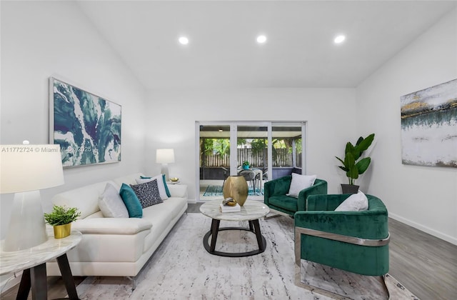 living room with recessed lighting, baseboards, vaulted ceiling, and wood finished floors
