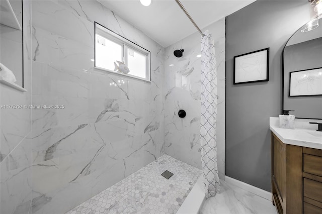 full bathroom featuring baseboards, marble finish floor, a marble finish shower, and vanity