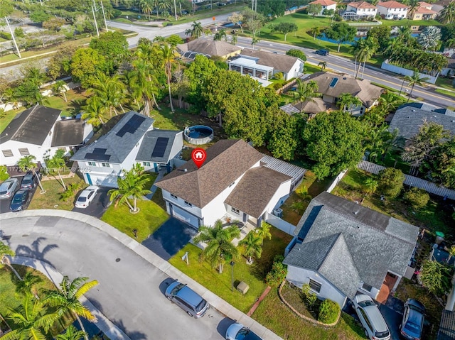 birds eye view of property with a residential view