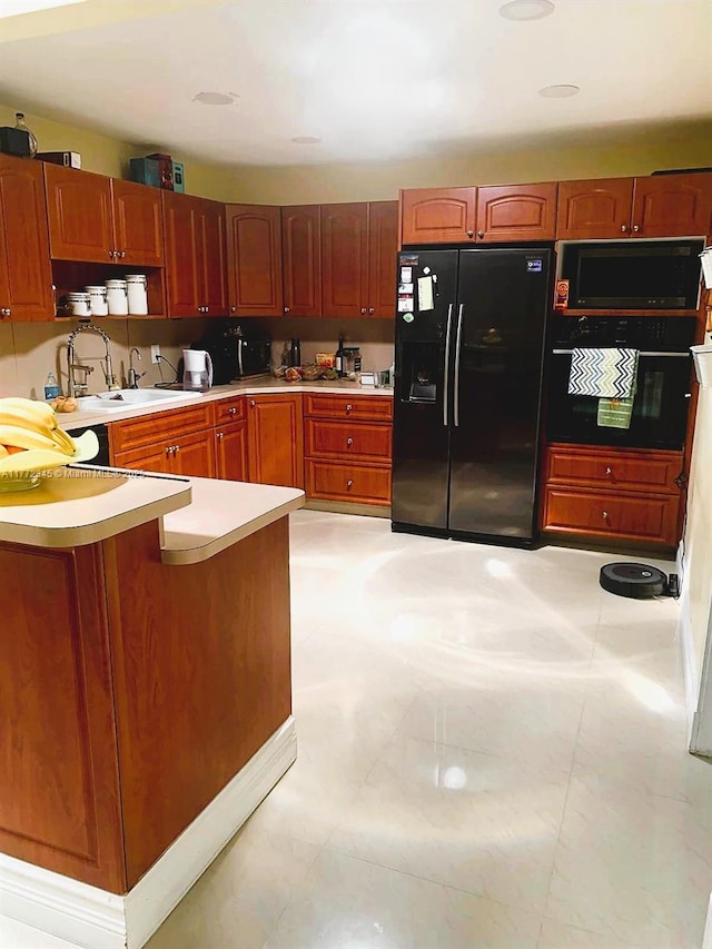 3190 NW 66th Dr, Fort Lauderdale, FL 33309 - kitchen with black appliances, a sink, and light countertops