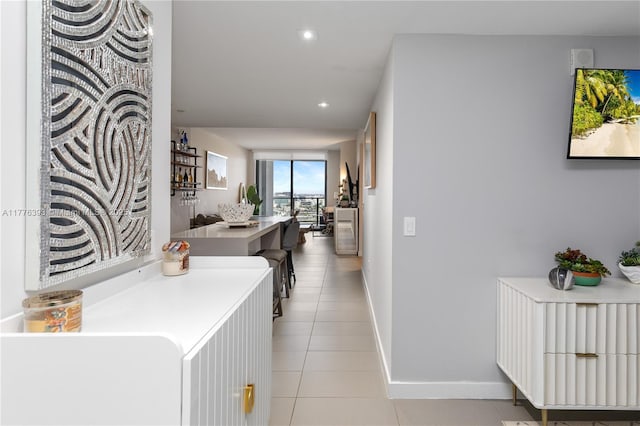 1600 NE 1st Ave Unit 2615, Miami, FL 33132 - corridor with light tile patterned flooring, baseboards, and recessed lighting