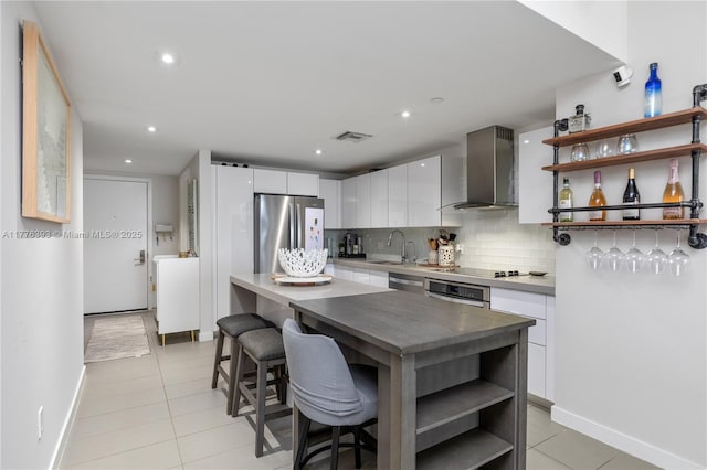 1600 NE 1st Ave Unit 2615, Miami, FL 33132 - kitchen featuring appliances with stainless steel finishes, wall chimney exhaust hood, open shelves, light tile patterned floors, and recessed lighting