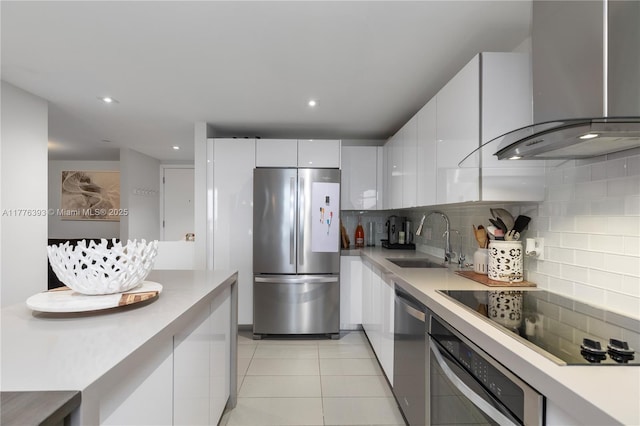 1600 NE 1st Ave Unit 2615, Miami, FL 33132 - kitchen featuring stainless steel appliances, wall chimney range hood, a sink, decorative backsplash, and recessed lighting
