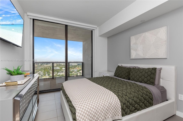 1600 NE 1st Ave Unit 2615, Miami, FL 33132 - bedroom with floor to ceiling windows and light tile patterned floors