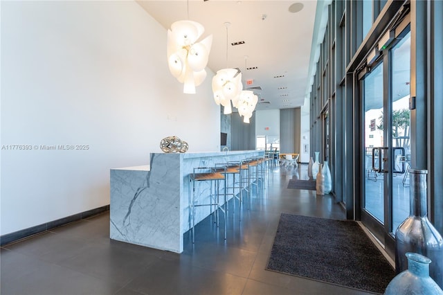 1600 NE 1st Ave Unit 2615, Miami, FL 33132 - dining space featuring a high ceiling and dark tile patterned floors
