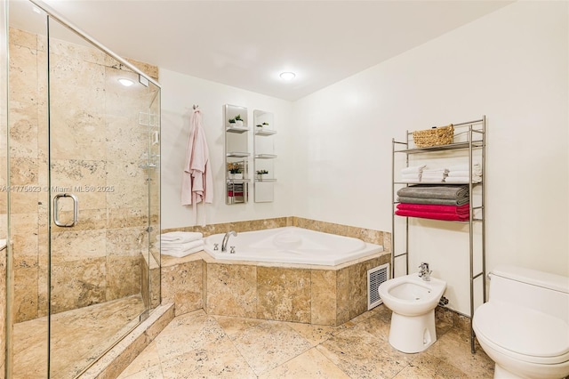 bathroom featuring a bath, visible vents, a shower stall, toilet, and a bidet