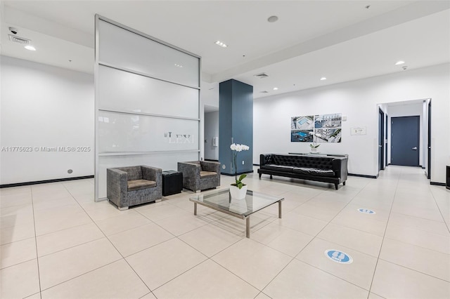 interior space featuring baseboards, recessed lighting, and light tile patterned floors