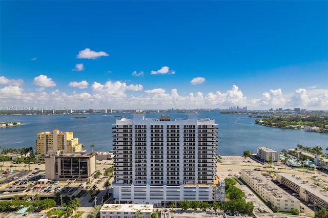 bird's eye view featuring a water view and a city view