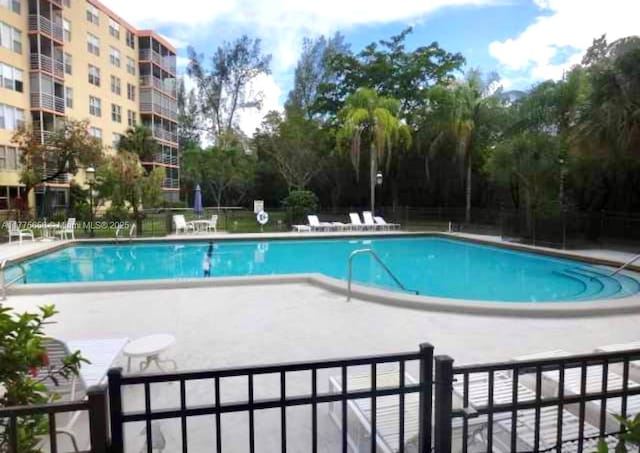 17890 W Dixie Hwy Unit 714, North Miami Beach, FL 33160 - community pool featuring fence and a patio