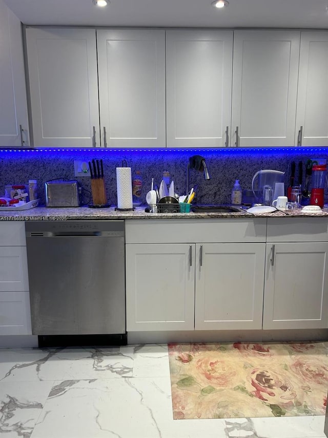 17890 W Dixie Hwy Unit 714, North Miami Beach, FL 33160 - kitchen with backsplash, marble finish floor, a sink, stone countertops, and dishwasher
