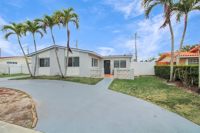 9215 SW 44th St, Miami, FL 33165 - view of front of house with a front lawn, fence, and concrete driveway