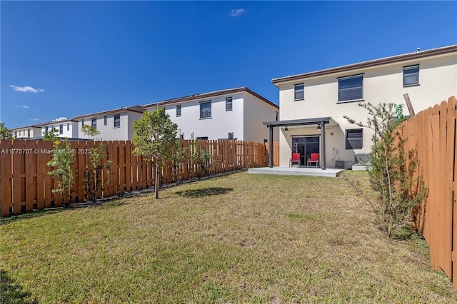 view of yard with a fenced backyard and a patio