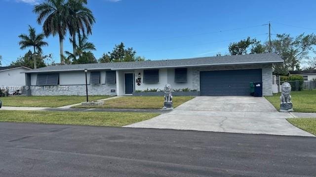 9380 SW 179th Ter, Palmetto Bay, FL 33157 - ranch-style home with driveway, a front lawn, and an attached garage