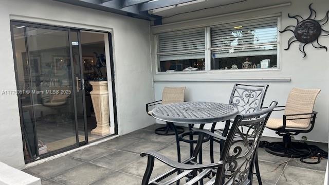 9380 SW 179th Ter, Palmetto Bay, FL 33157 - balcony featuring a patio