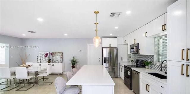 bathroom with toilet, a stall shower, and vanity