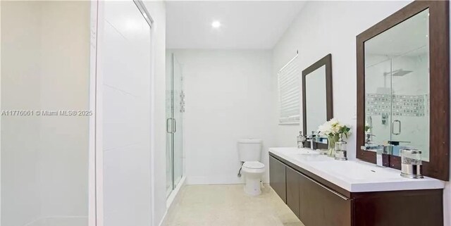 9380 SW 179th Ter, Palmetto Bay, FL 33157 - bathroom featuring toilet, a stall shower, vanity, and recessed lighting