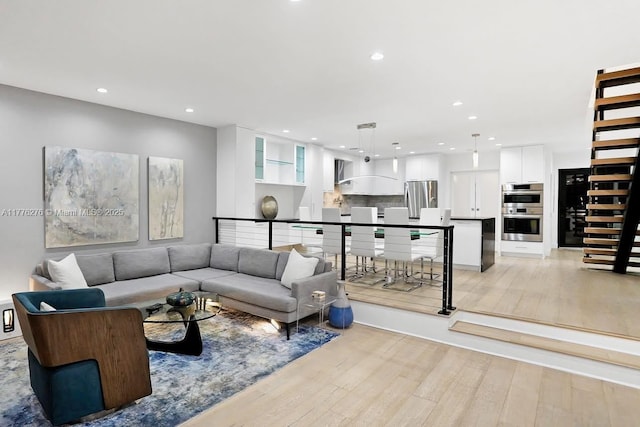 3543 S Ocean Blvd Unit 103, South Palm Beach, FL 33480 - living area with light wood-style floors and recessed lighting