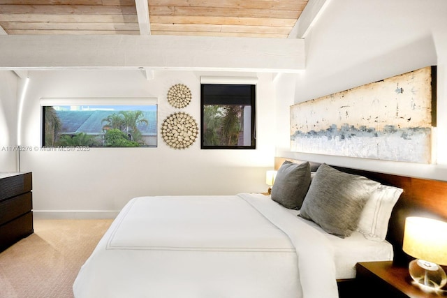 3543 S Ocean Blvd Unit 103, South Palm Beach, FL 33480 - carpeted bedroom with a wood ceiling with exposed beams and baseboards