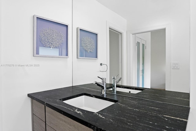 3543 S Ocean Blvd Unit 103, South Palm Beach, FL 33480 - kitchen featuring a sink and dark stone countertops