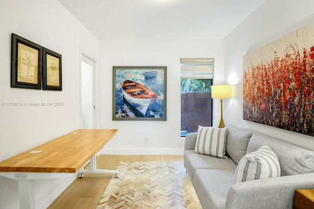 3543 S Ocean Blvd Unit 103, South Palm Beach, FL 33480 - living area featuring light wood-style flooring and baseboards