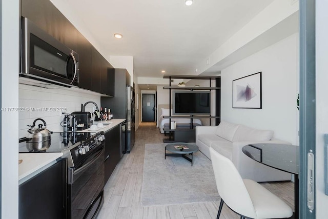 398 NE 5th St Unit 1408, Miami, FL 33132 - living room featuring light wood-style floors and recessed lighting