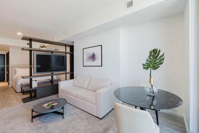 398 NE 5th St Unit 1408, Miami, FL 33132 - living area featuring wood finished floors, recessed lighting, and visible vents