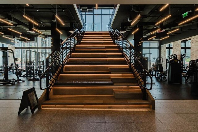 398 NE 5th St Unit 1408, Miami, FL 33132 - gym featuring a towering ceiling and expansive windows