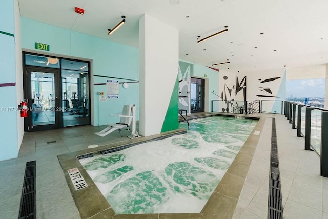 398 NE 5th St Unit 1408, Miami, FL 33132 - gym with french doors and tile patterned flooring