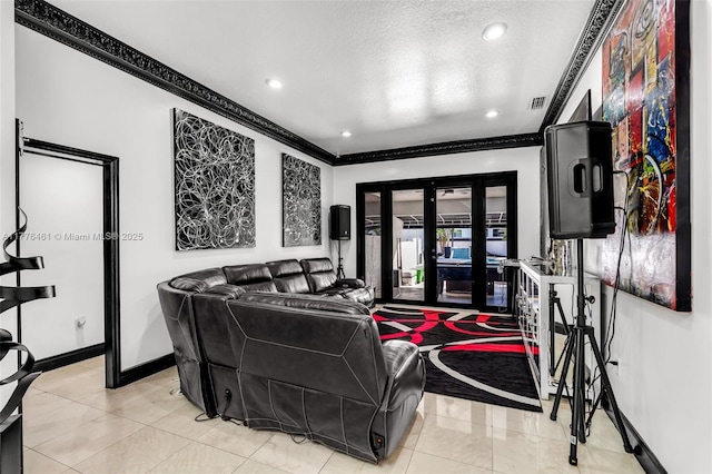 tiled living area with baseboards, a textured ceiling, ornamental molding, and french doors