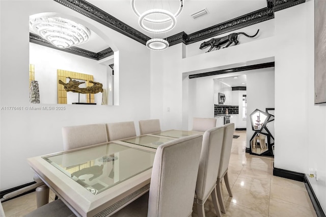 dining space featuring marble finish floor, visible vents, arched walkways, and ornamental molding