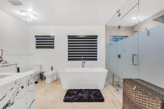 full bath featuring visible vents, a soaking tub, toilet, a bidet, and a stall shower