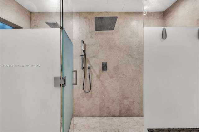 full bath with a tile shower