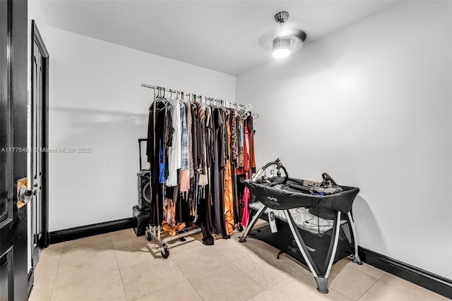 spacious closet featuring light tile patterned floors