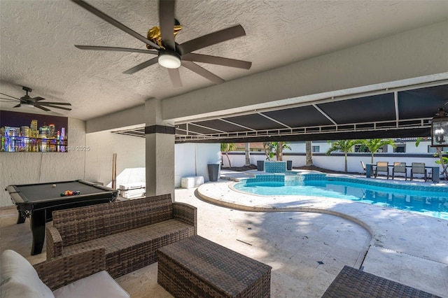 outdoor pool featuring fence, ceiling fan, and a patio