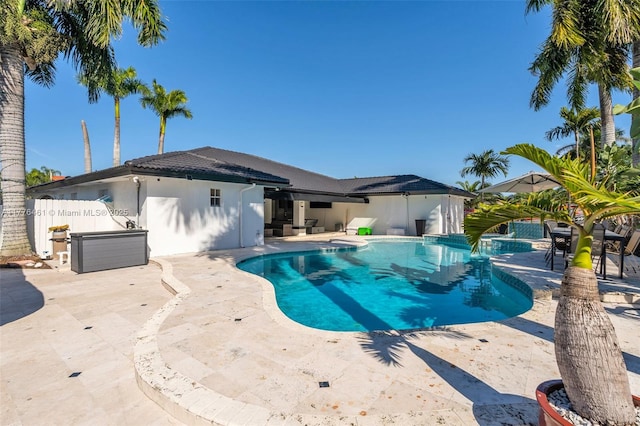 view of swimming pool featuring a fenced in pool, fence, and a patio