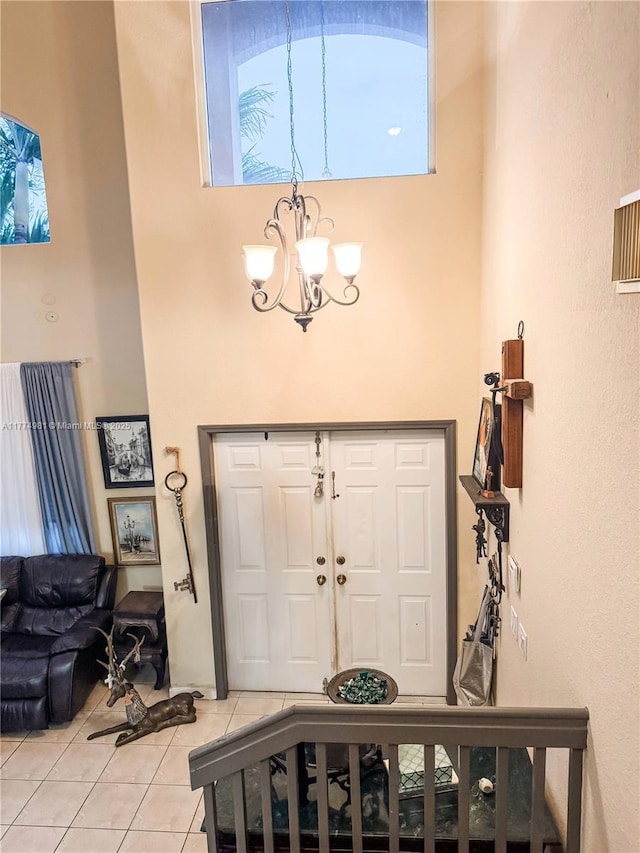 15809 SW 65th Ter, Miami, FL 33193 - entryway featuring a towering ceiling, a chandelier, and light tile patterned floors