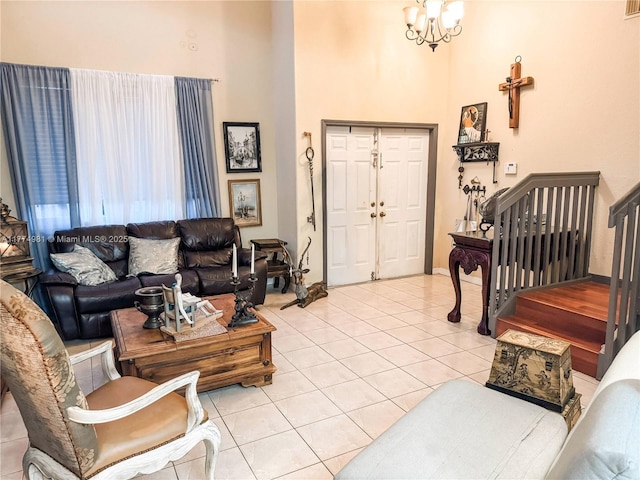15809 SW 65th Ter, Miami, FL 33193 - living room with stairway, an inviting chandelier, baseboards, light tile patterned flooring, and a towering ceiling
