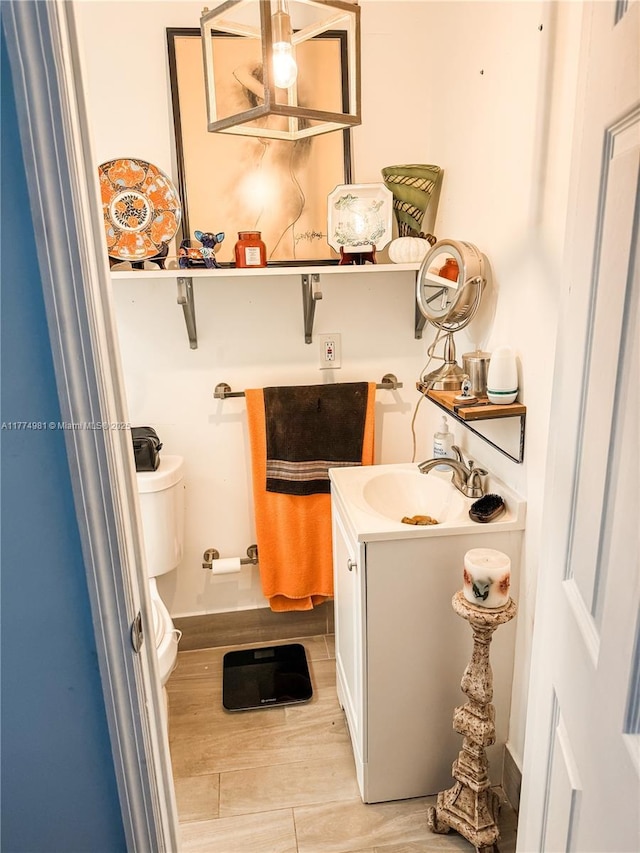 15809 SW 65th Ter, Miami, FL 33193 - half bathroom with toilet, vanity, and wood finished floors