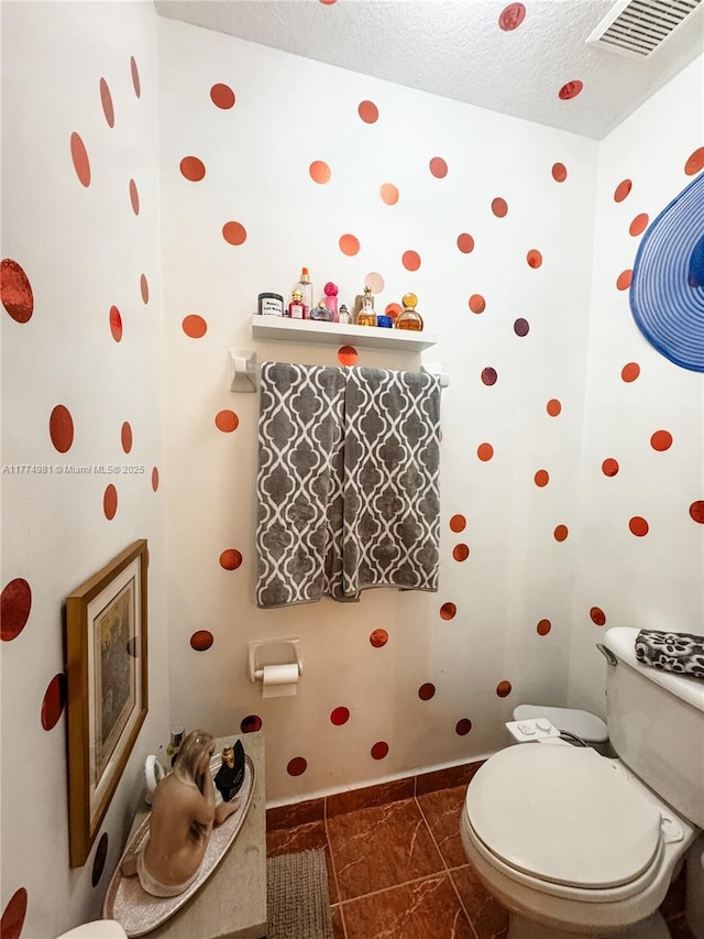 15809 SW 65th Ter, Miami, FL 33193 - half bathroom with baseboards, a textured ceiling, visible vents, and toilet