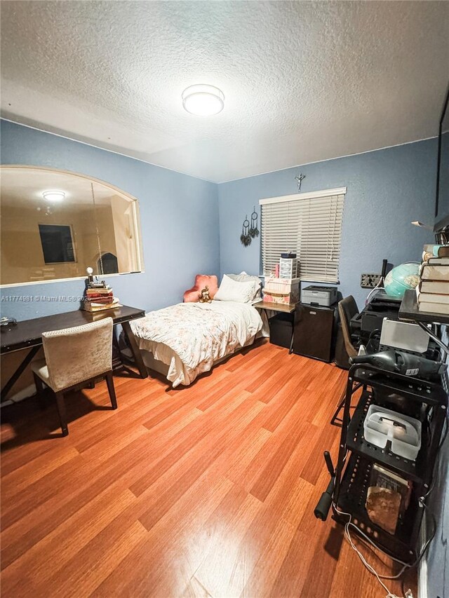 15809 SW 65th Ter, Miami, FL 33193 - bedroom featuring a textured ceiling and wood finished floors