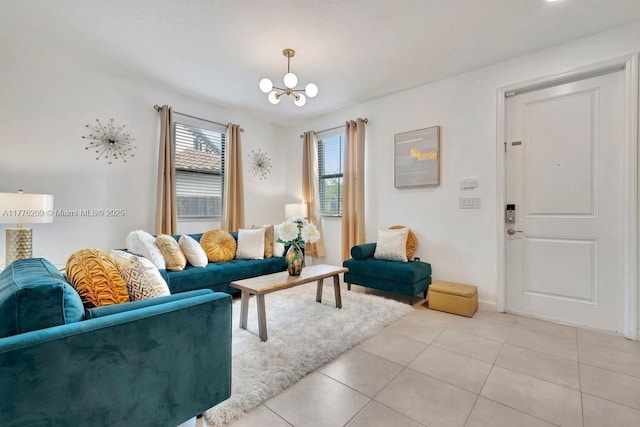 living room with a notable chandelier and light tile patterned floors