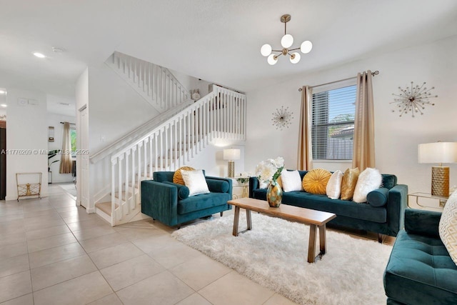 living area with light tile patterned floors, stairway, and a notable chandelier
