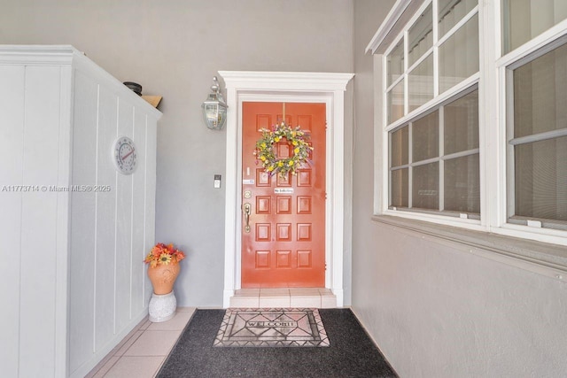 view of exterior entry featuring stucco siding