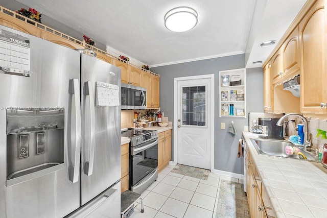 kitchen with tasteful backsplash, a sink, tile countertops, light brown cabinetry, and stainless steel appliances