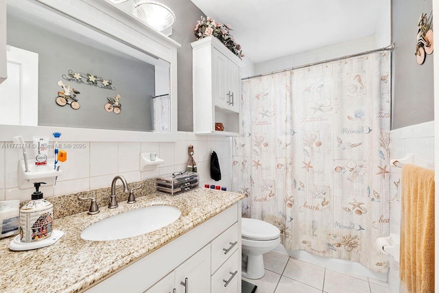 full bathroom with tile patterned floors, toilet, tile walls, decorative backsplash, and vanity